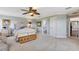 Spacious bedroom with a king-size bed, ceiling fan, and en-suite bathroom at 21210 77Th E Ave, Bradenton, FL 34202
