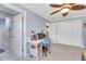 This bedroom features a ceiling fan, closet and a desk area perfect for work or studying at 21210 77Th E Ave, Bradenton, FL 34202