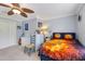 This bedroom features a ceiling fan and a playful basketball-themed bedding set at 21210 77Th E Ave, Bradenton, FL 34202