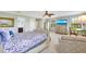 Bright bedroom with large windows, stylish furniture, and soft carpeting at 21210 77Th E Ave, Bradenton, FL 34202