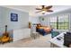 Cozy bedroom with natural light, a desk, and carpet flooring at 21210 77Th E Ave, Bradenton, FL 34202