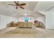 Spacious bonus room features neutral carpet, ceiling fan, and comfortable seating at 21210 77Th E Ave, Bradenton, FL 34202