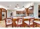 Spacious kitchen features wood cabinets, stainless steel appliances, and a large island with counter seating at 21210 77Th E Ave, Bradenton, FL 34202