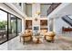 Open living area with fireplace, high ceilings, and sliding doors to outdoor space at 21210 77Th E Ave, Bradenton, FL 34202