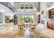 Bright living area with high ceilings, modern lighting, and an open layout at 21210 77Th E Ave, Bradenton, FL 34202