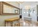 Elegant main bathroom with a soaking tub and large mirror at 21210 77Th E Ave, Bradenton, FL 34202