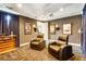 Relax in this comfy theater room with plush seating and a projector for movie nights at 21210 77Th E Ave, Bradenton, FL 34202