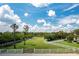Expansive fenced-in yard with lush greenery and mature trees, perfect for outdoor activities at 21210 77Th E Ave, Bradenton, FL 34202
