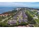 Spectacular aerial view of Harbour Oaks, highlighting its coastal setting, golf course, and residential properties at 2155 Harbourside Dr # 804, Longboat Key, FL 34228