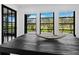 Close-up of a dining table with a decorative bowl, flooded with natural light at 2155 Harbourside Dr # 804, Longboat Key, FL 34228