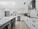 Modern kitchen with stainless steel appliances, and large center island at 2155 Harbourside Dr # 804, Longboat Key, FL 34228