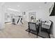 Open-concept kitchen features white cabinetry, island with waterfall countertop, and modern appliances at 2155 Harbourside Dr # 804, Longboat Key, FL 34228
