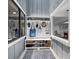 Functional mudroom with custom storage, decorative rug, and natural light at 2155 Harbourside Dr # 804, Longboat Key, FL 34228