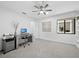 Bright office space with modern desk and decor, next to a window and built-in bookshelves at 2155 Harbourside Dr # 804, Longboat Key, FL 34228