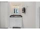 Bathroom with vanity, mirror, storage, and white cabinets at 2415 Bayshore Gardens Pkwy # 2, Bradenton, FL 34207