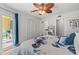 Bright bedroom with a king-size bed, closet, access to a private balcony, and an en-suite bathroom at 2415 Bayshore Gardens Pkwy # 2, Bradenton, FL 34207