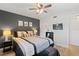 Cozy bedroom boasting a ceiling fan, mounted TV, and modern decor for a relaxing atmosphere at 2415 Bayshore Gardens Pkwy # 2, Bradenton, FL 34207