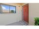 Welcoming front entrance with a beautifully painted door, stylish light fixture, and a cozy 'Welcome' mat at 2415 Bayshore Gardens Pkwy # 2, Bradenton, FL 34207