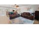 Spacious living room featuring hardwood floors, ceiling fan, and modern decor at 2415 Bayshore Gardens Pkwy # 2, Bradenton, FL 34207