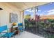 Charming patio with outdoor seating, strung lights, and garden views at 2415 Bayshore Gardens Pkwy # 2, Bradenton, FL 34207