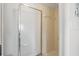 Bright bathroom featuring a step-in shower with a glass door and a neutral color palette at 2415 Bayshore Gardens Pkwy # 2, Bradenton, FL 34207