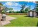 Large backyard featuring a wooden fence and storage shed, perfect for outdoor activities at 2761 Feiffer Cir, Sarasota, FL 34235