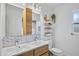Bright bathroom with double sinks, contemporary vanity, and wood accents at 2761 Feiffer Cir, Sarasota, FL 34235
