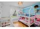 Charming Bedroom with bunk beds, crib and natural light at 2761 Feiffer Cir, Sarasota, FL 34235