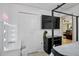 Bedroom featuring a TV, modern decor, closet, and desk at 2761 Feiffer Cir, Sarasota, FL 34235