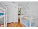 Bedroom featuring a crib, bunk beds and decorated with cute decals at 2761 Feiffer Cir, Sarasota, FL 34235