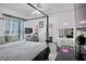 Bedroom with a gray bed, a desk, vanity, and modern decor at 2761 Feiffer Cir, Sarasota, FL 34235