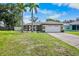 Beautiful single-story home with a well-manicured lawn and two-car garage at 2761 Feiffer Cir, Sarasota, FL 34235