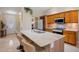 Bright kitchen with stainless appliances and large marble kitchen island at 2761 Feiffer Cir, Sarasota, FL 34235