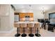 Modern kitchen with stainless steel appliances and breakfast bar seating at 2761 Feiffer Cir, Sarasota, FL 34235