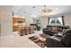 Bright living area with tile flooring, ceiling fan, and kitchen island seating at 2761 Feiffer Cir, Sarasota, FL 34235