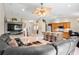 Bright, open-concept living area showcasing a spacious layout, modern furnishings, and a stylish kitchen island at 2761 Feiffer Cir, Sarasota, FL 34235