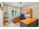Comfortable home office features built in shelving and natural lighting at 2761 Feiffer Cir, Sarasota, FL 34235