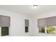 Bedroom featuring many windows and roller shades for a bright interior at 2919 Shannon Drive, Punta Gorda, FL 33950