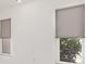 Bedroom featuring two windows with roller shades at 2919 Shannon Drive, Punta Gorda, FL 33950