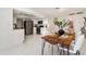 Open-concept dining area with a modern table, seating for six, and seamless access to the updated kitchen at 2919 Shannon Drive, Punta Gorda, FL 33950