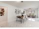 Elegant dining room featuring marble floors, stylish light fixture, and modern decor for memorable dinners at 2919 Shannon Drive, Punta Gorda, FL 33950