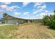 Beautiful one-story home featuring a lush green lawn and a convenient attached garage, perfect for families at 2919 Shannon Drive, Punta Gorda, FL 33950
