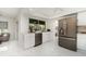 Bright kitchen featuring stainless steel appliances, white cabinetry, and marble floors for a modern look at 2919 Shannon Drive, Punta Gorda, FL 33950