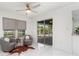 Cozy living room with modern chairs and windows with views of the pool and landscaping at 2919 Shannon Drive, Punta Gorda, FL 33950