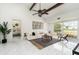 Bright living room with high ceilings, wood beams, marble floors, and modern furnishings creating an elegant space at 2919 Shannon Drive, Punta Gorda, FL 33950