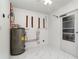 Utility room with water heater and door to exterior at 2919 Shannon Drive, Punta Gorda, FL 33950