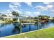 Scenic waterfront view featuring a boat lift and canal-front property, ideal for boating enthusiasts at 2919 Shannon Drive, Punta Gorda, FL 33950
