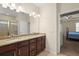 Bathroom featuring double sinks, granite countertops, and a glass-enclosed shower at 2920 Oriole Dr, Sarasota, FL 34243