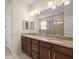 Spacious bathroom featuring a double vanity with granite counters and a glass-enclosed shower at 2920 Oriole Dr, Sarasota, FL 34243