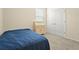 This carpeted bedroom has a bed, a desk, and a large closet at 2920 Oriole Dr, Sarasota, FL 34243